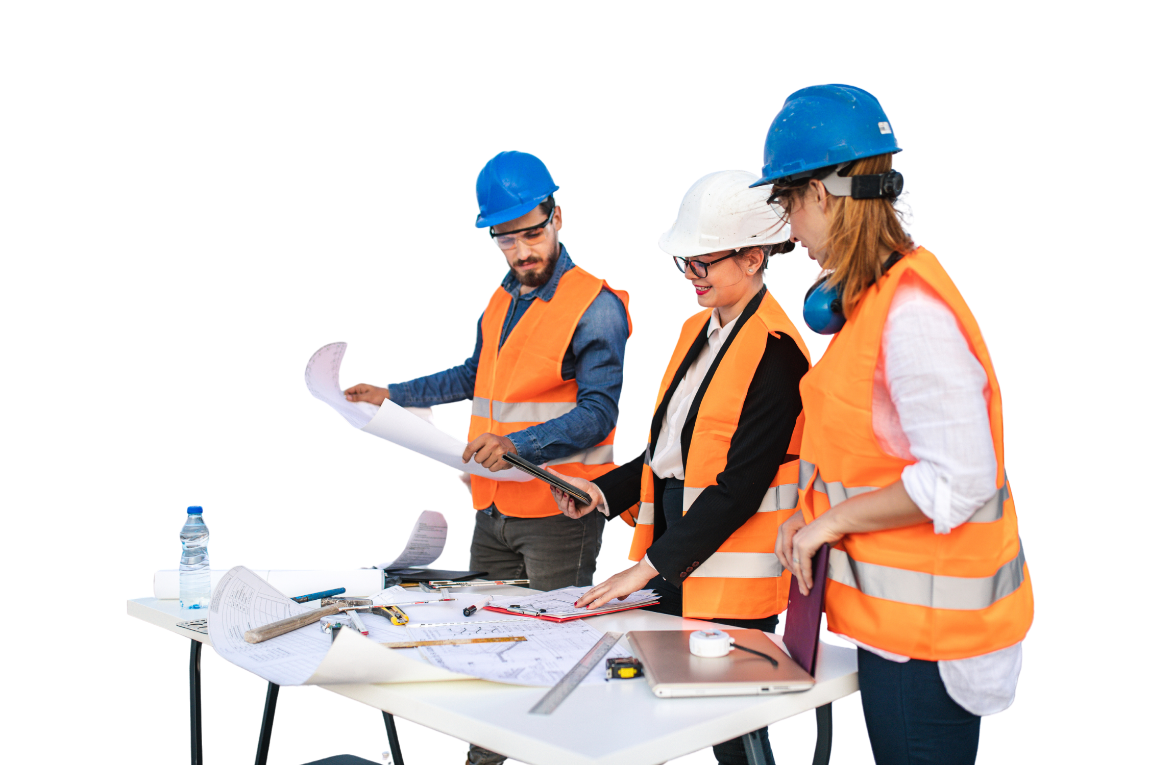 Three construction professionals in hard hats and safety vests reviewing architectural plans and digital data on a tablet in a workspace.