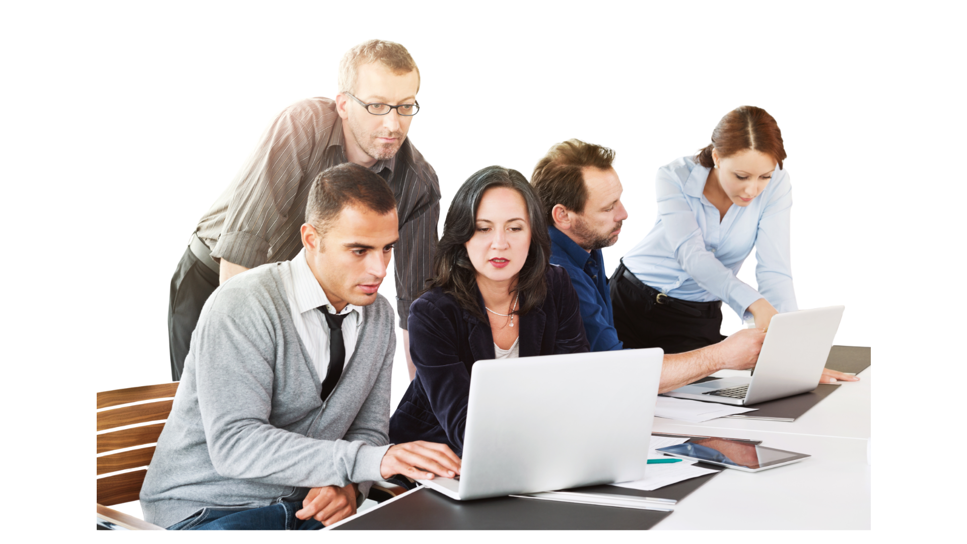 Multi-Generational Team Collaborating on Digital Projects A diverse group of five business professionals gathered around laptops and tablets on a white desk, engaged in a collaborative technical task against a black background.