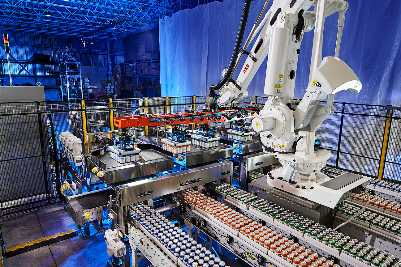 Robotic arm handling variety pack uncasing on a Descon automated production line